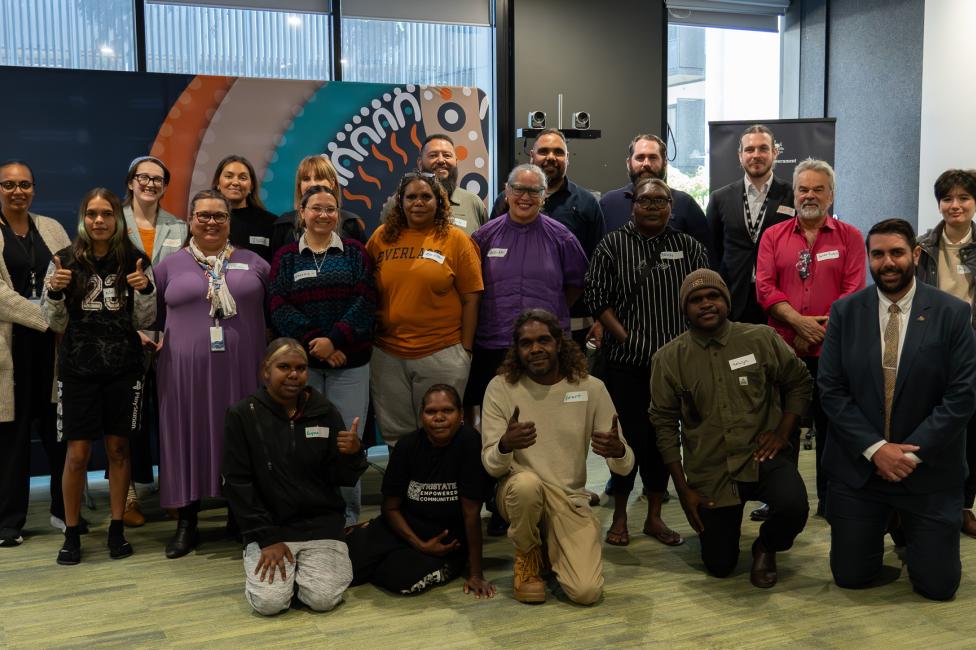 Group photo of emerging leaders inside an office space