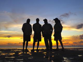 Warraberalgal Rangers on their land and sea country at dusk. Photo: © Nick Layne