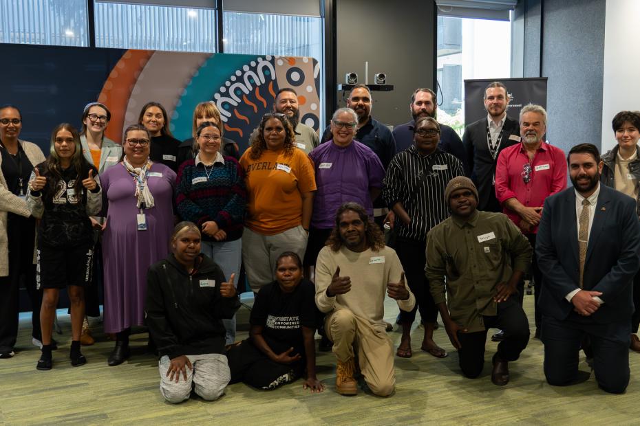 Group photo of emerging leaders inside an office space