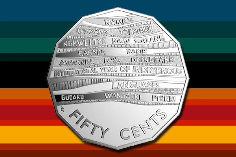 Image shows new 50 cent coin against a multi coloured background