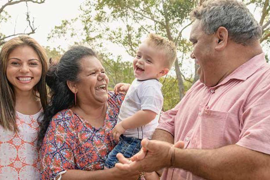 image of a family - a mother and father, their young daughter and an infant boy