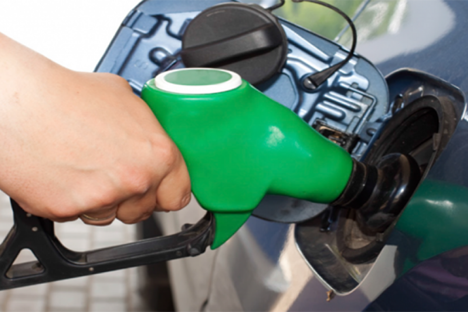 Image of a hand on a petrol pump